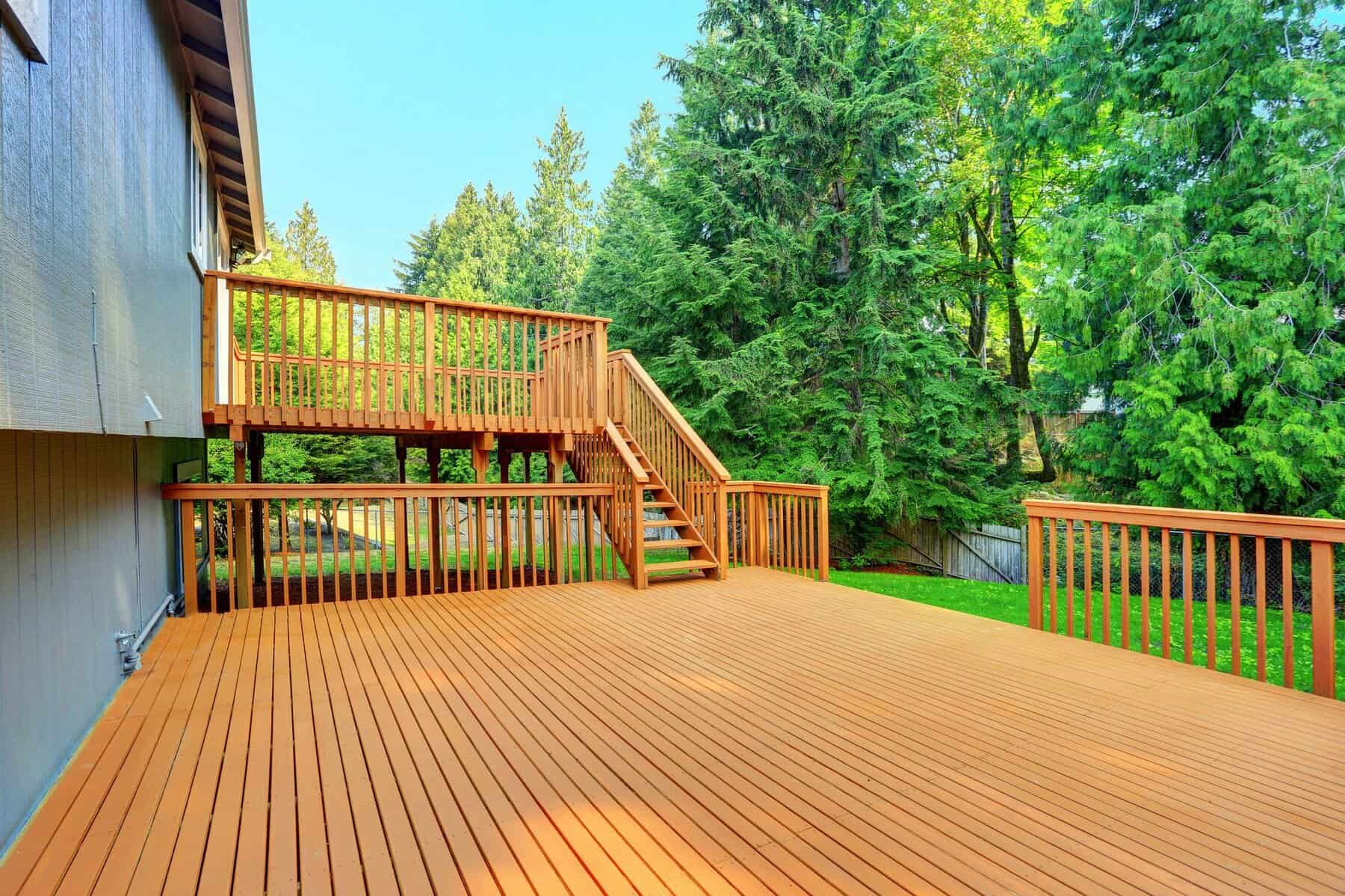 Deck and fence painting service showing outdoor space enhancement