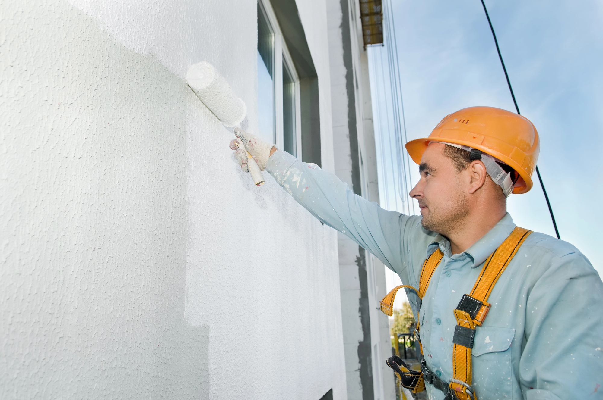 Residential exterior house painting makeover with premium weather-resistant paints
